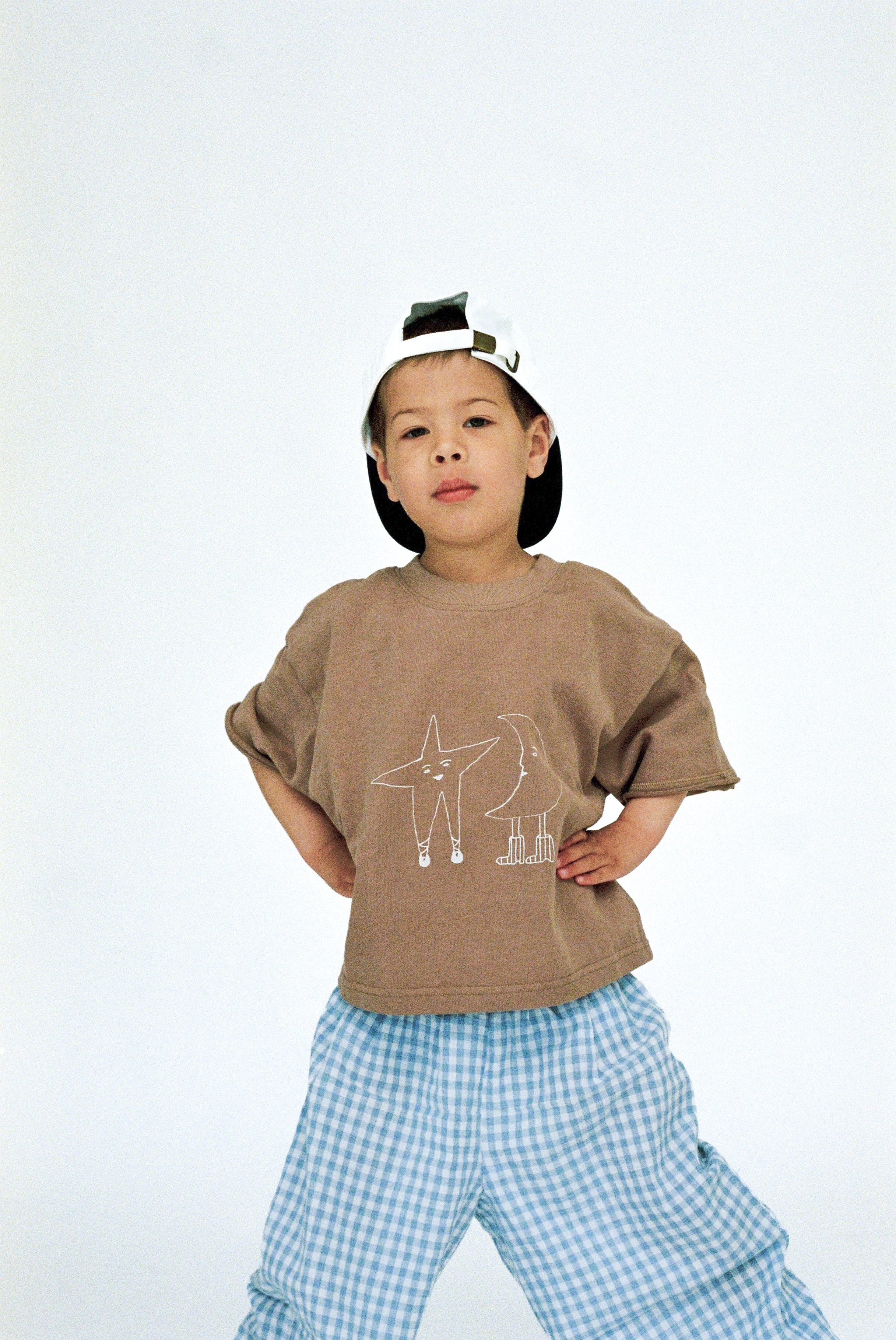 Jai Studios Stella Tee in soft fabric with a relaxed fit, shown in a neutral color on a mannequin.
