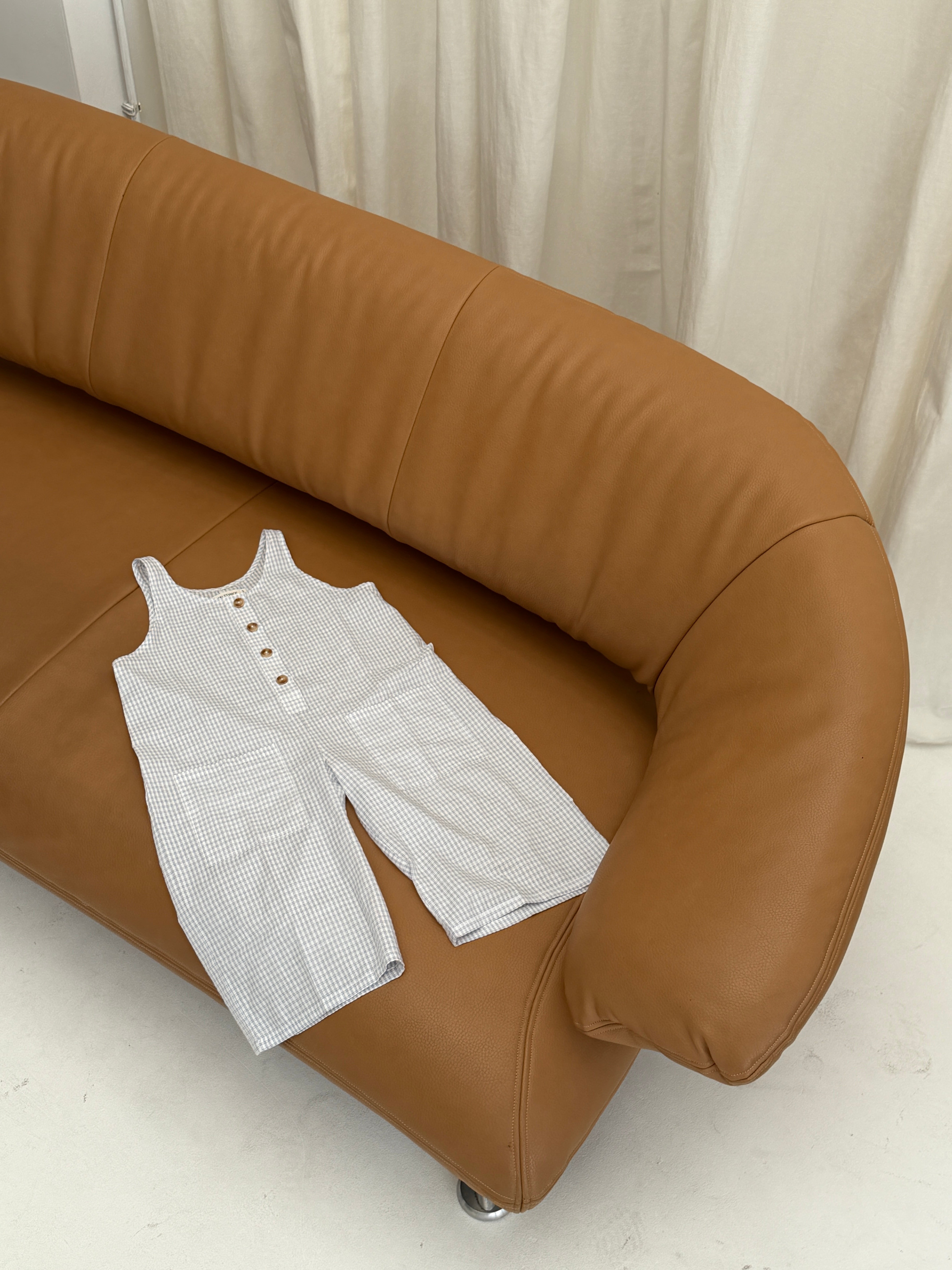 Jai Studios Lumi Overalls in soft fabric, featuring adjustable straps and a relaxed fit, shown on a model.