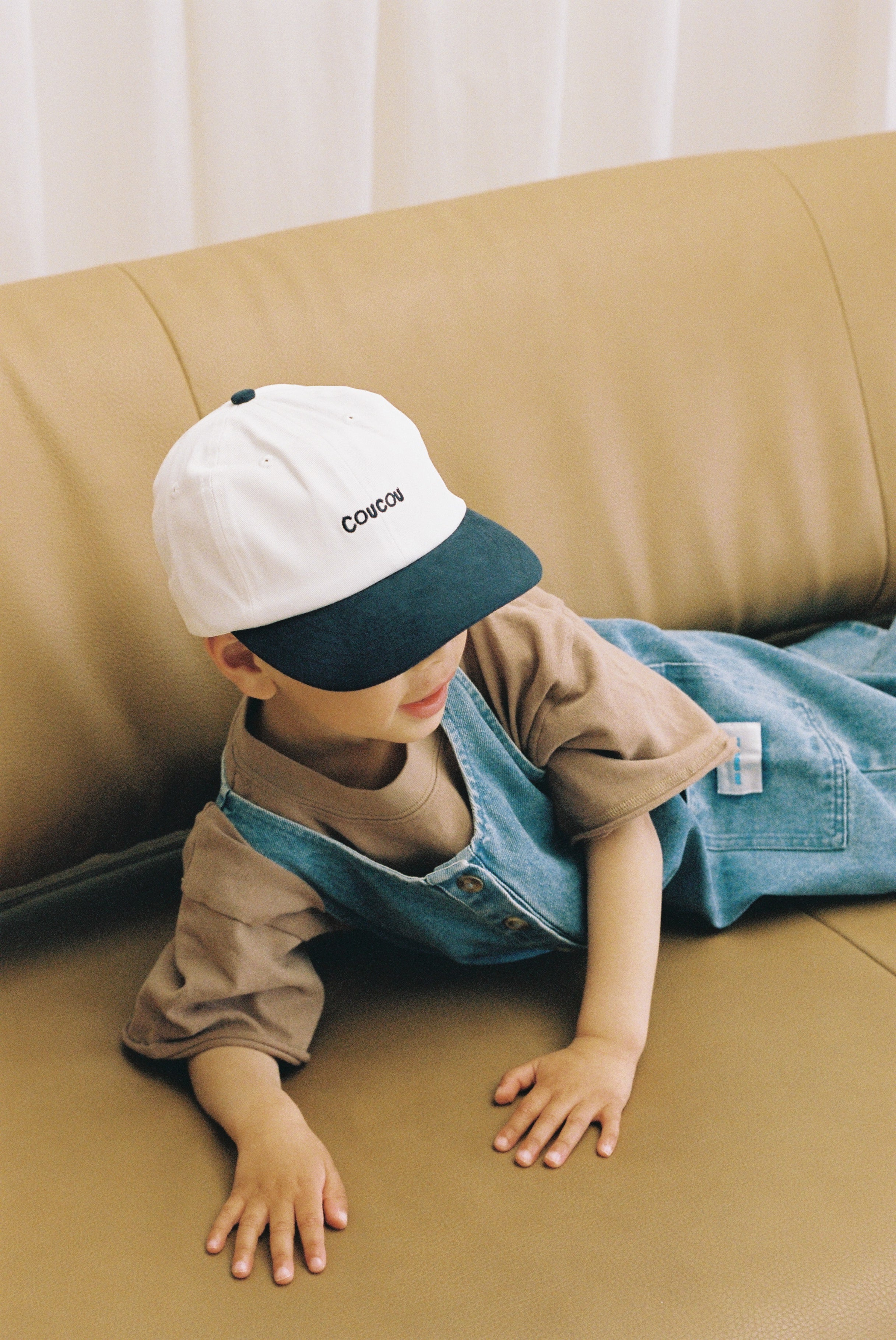 My Store Coucou Cap in vibrant colors, featuring a stylish design with adjustable strap and embroidered logo on the front.